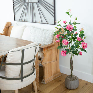 Lifestyle photo showing the artificial rose tree in a real room environment.