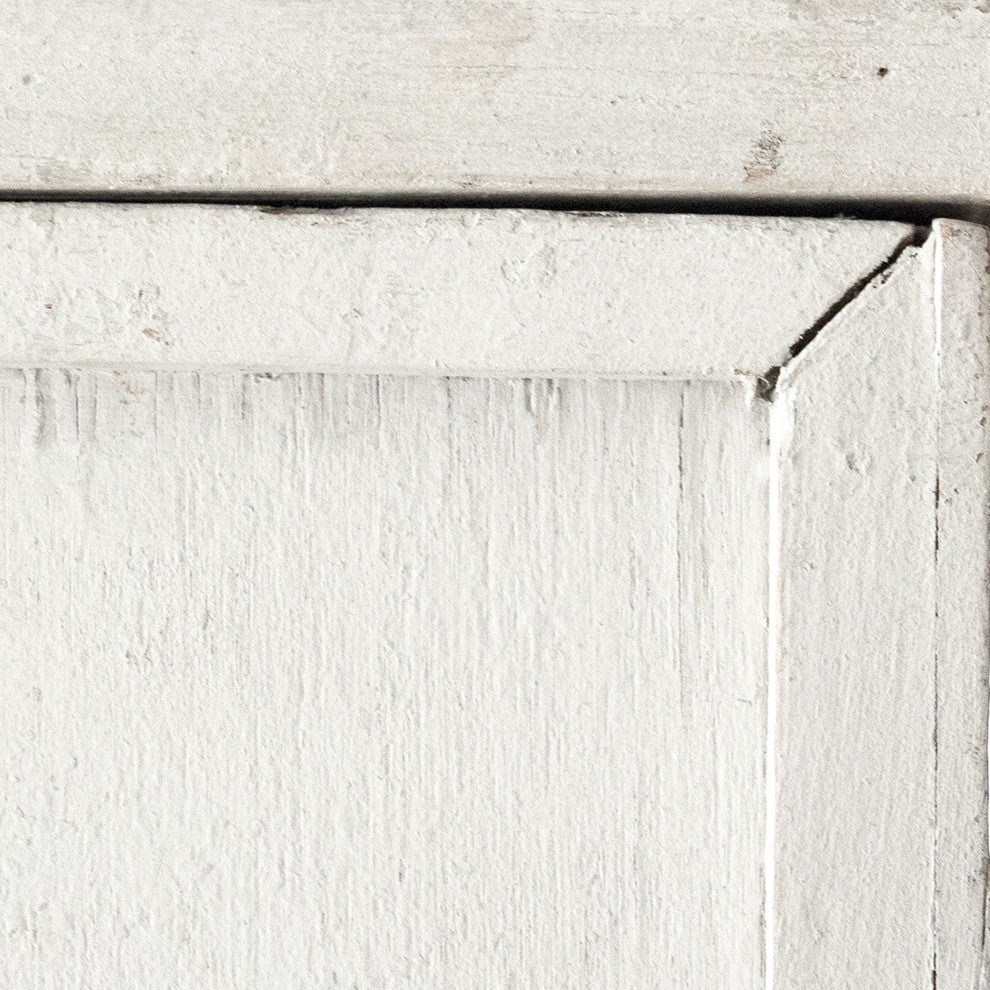 Close-up of cabinet edge/texture on white background.