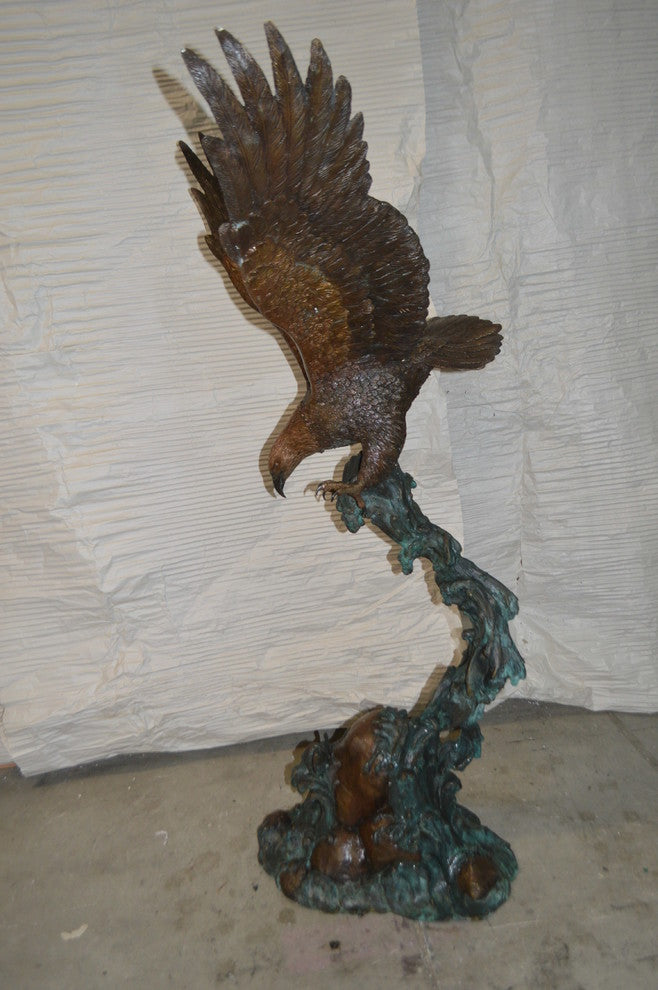 Flying Eagle on Wave Bronze Statue -  Size: 25"L x 35"W x 57"H.