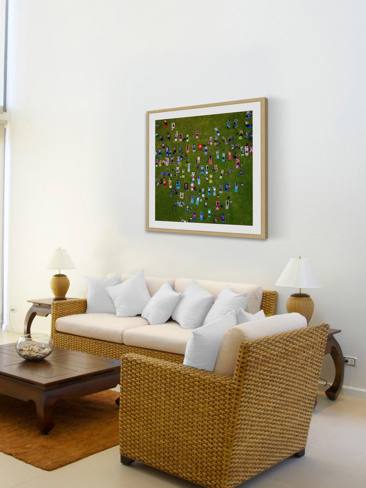 "People On Towels" Framed Print by Karolis Janulis