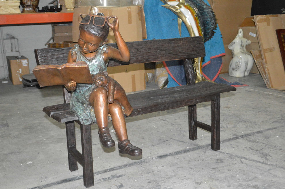 Girl with Glasses on Bench  Bronze Statue -  Size: 43"L x 20"W x 36"H.