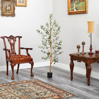 Lifestyle image showing the tree placed in a room with furniture.