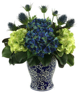 Assorted Hydrangea and Thistle Arrangement in a Decorative Ceramic Vase