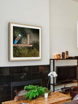 "Blue Boat" Framed Print by Karolis Janulis