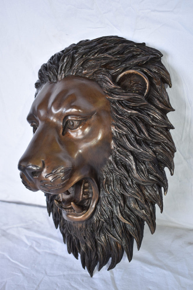 Wall Mounted Lion Face Fountain Made of Bronze Size: 12"L x 8"W x 18"H.
