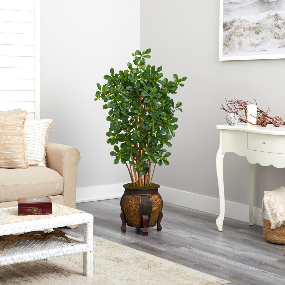 Shown in a real living room setting with sofa and decor.