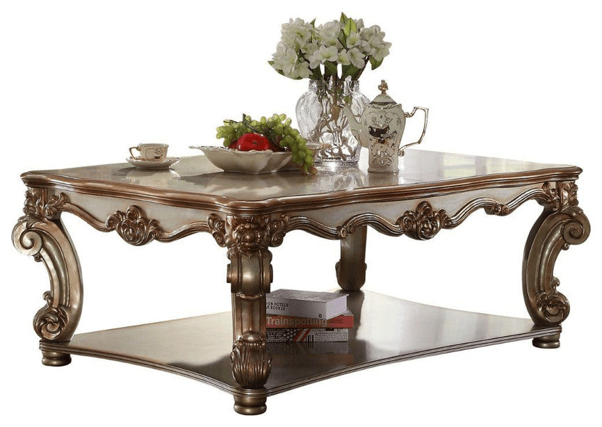 58" Gold Solid And Manufactured Wood Coffee Table With Shelf