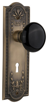 Meadows Plate Passage Black Porcelain Knob, Antique Brass