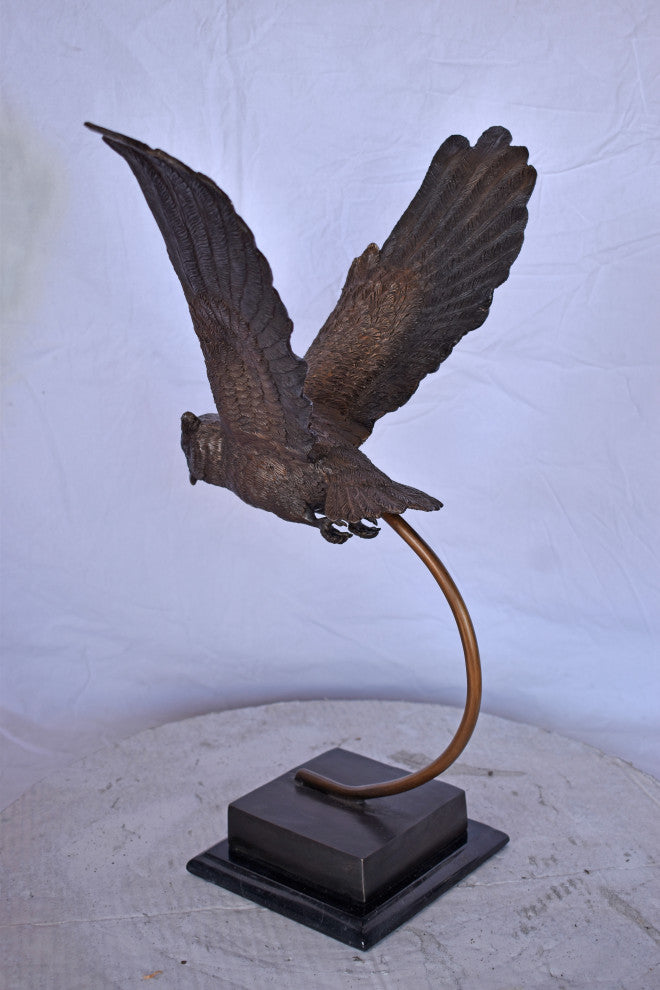 Owl Searching for Prey Bronze Statue Size: 18"L x 11"W x 22"H.