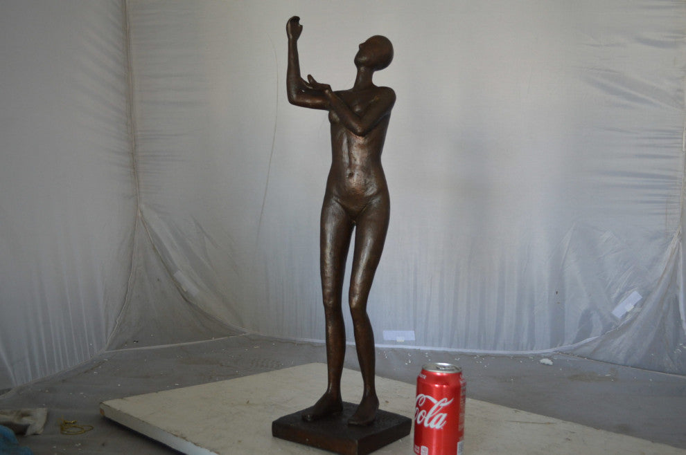 Abstract of nude lady lifting hand bronze statue - Size: 9"L x 6"W x 25"H.
