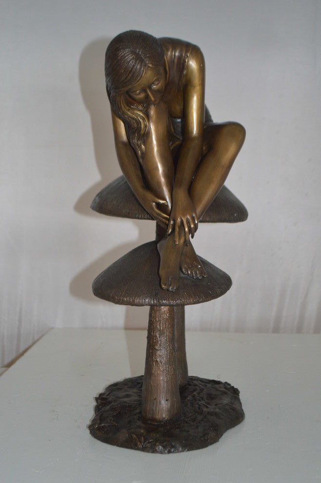 Girl sitting on Mushrooms Bronze Statue -  Size: 13"L x 11"W x 18"H.
