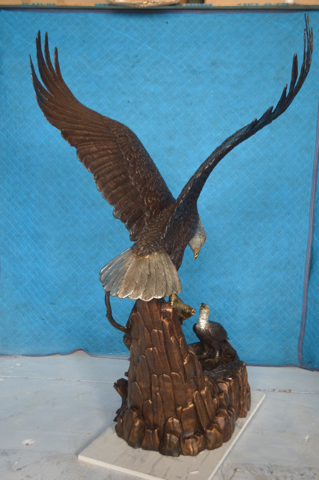 Eagle with nest Bronze Statue -  Size: 36"L x 40"W x 63"H.