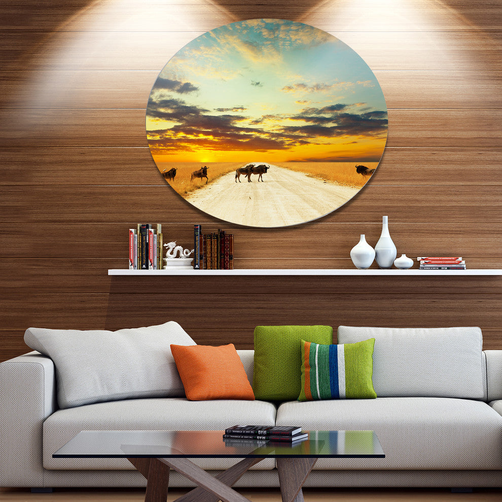 Wildebeests Crossing Path In Evening, African Disc Metal Wall Art, 23"