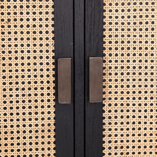 Close-up of woven cane panel and handles on white background.