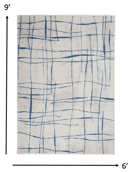 6' X 9' Blue And Ivory Abstract Dhurrie Area Rug