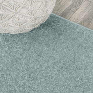Haze Solid Low-Pile Light Blue 6 ft. x 9 ft. Oval Area Rug