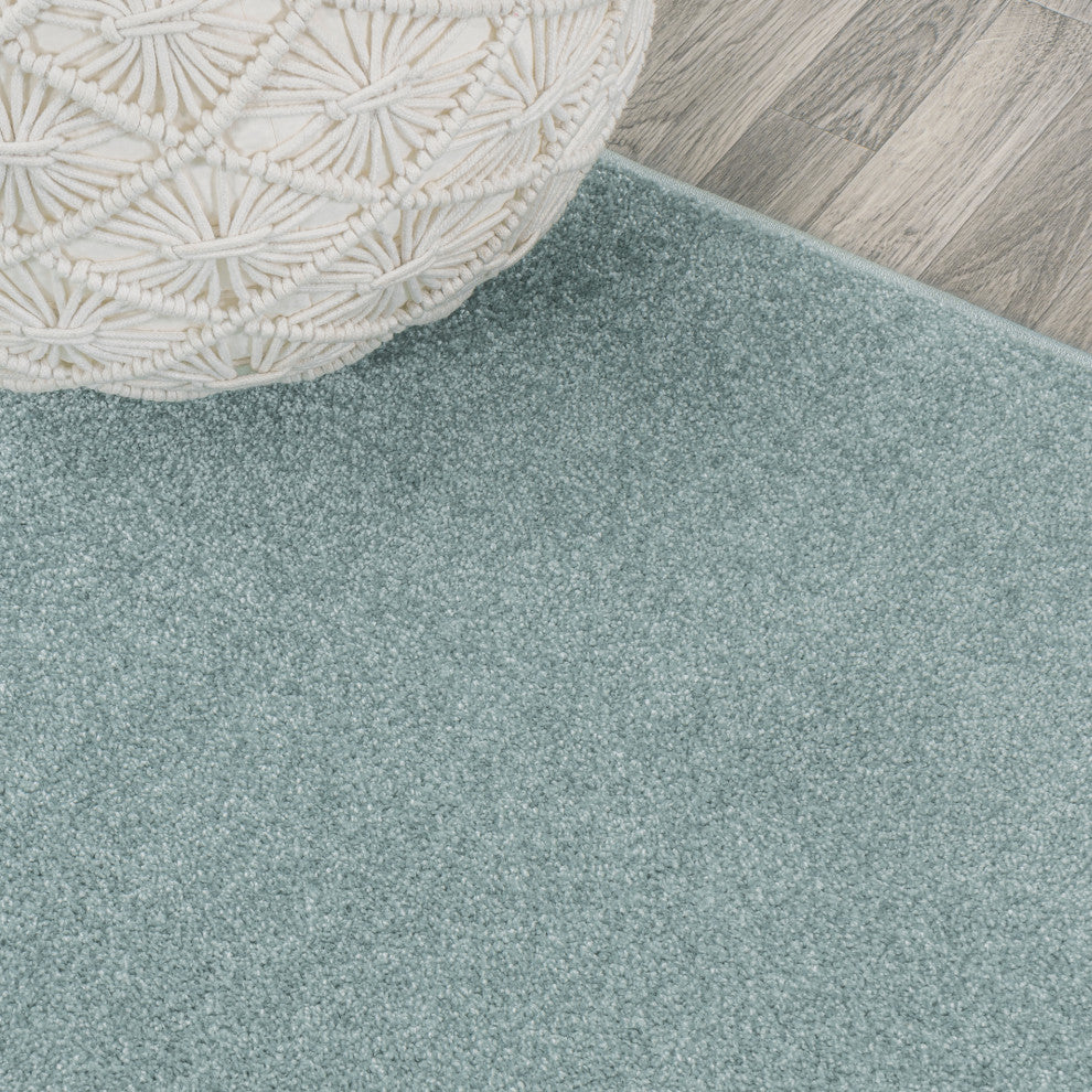 Haze Solid Low-Pile Light Blue 6 ft. x 9 ft. Oval Area Rug