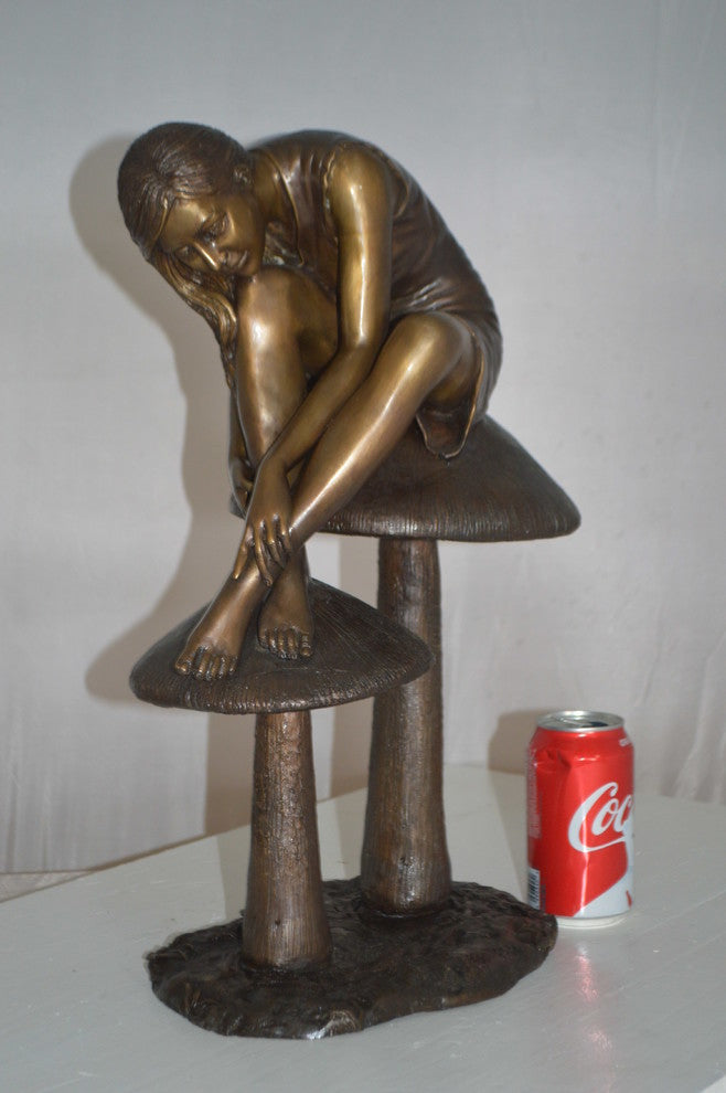 Girl sitting on Mushrooms Bronze Statue -  Size: 13"L x 11"W x 18"H.