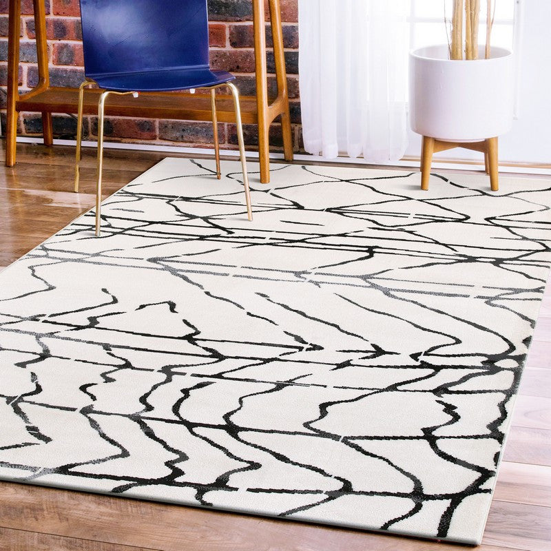 5" x 7" Cream and Black Distored Berber Area Rug