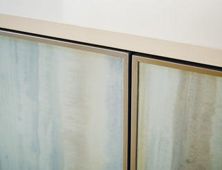 Close-up of panel edges on white background; texture/detail visible.