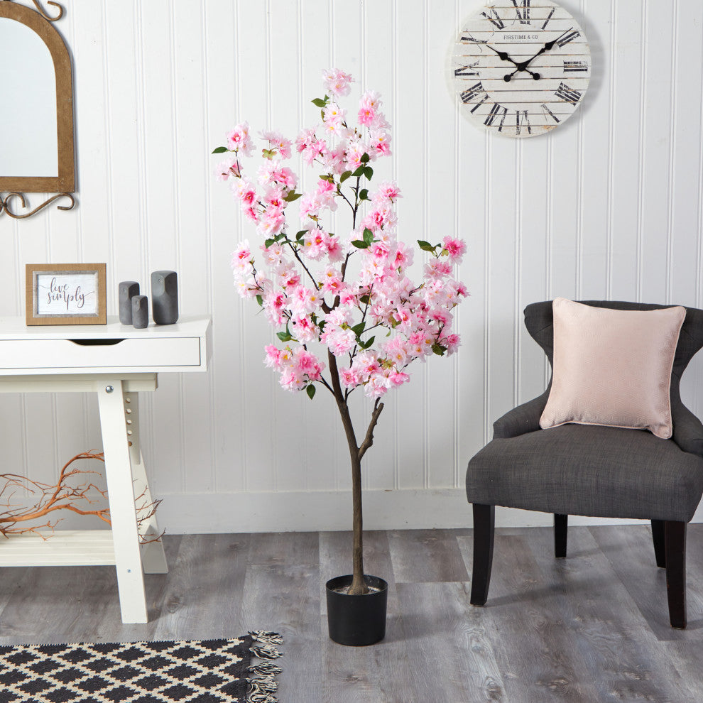 Lifestyle image showing the artificial tree in a home environment.