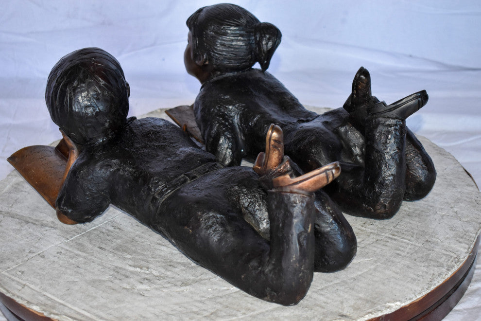 Young Kids Laying and Reading Cheerfully Bronze Statue Set Size: 20" x 13" x 8