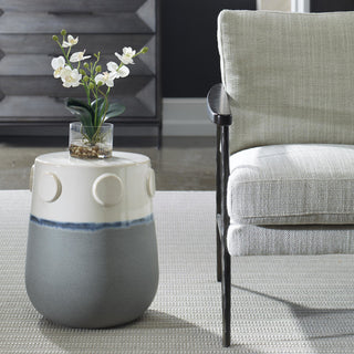 Lifestyle image showing the ceramic accent table in a real room setting with the full product visible.