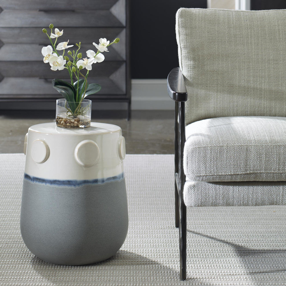 Lifestyle image showing the ceramic accent table in a real room setting with the full product visible.
