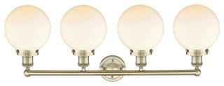 Large Beacon 4-Light 34" Vanity Light, Antique Brass Finish, Matte White Shade
