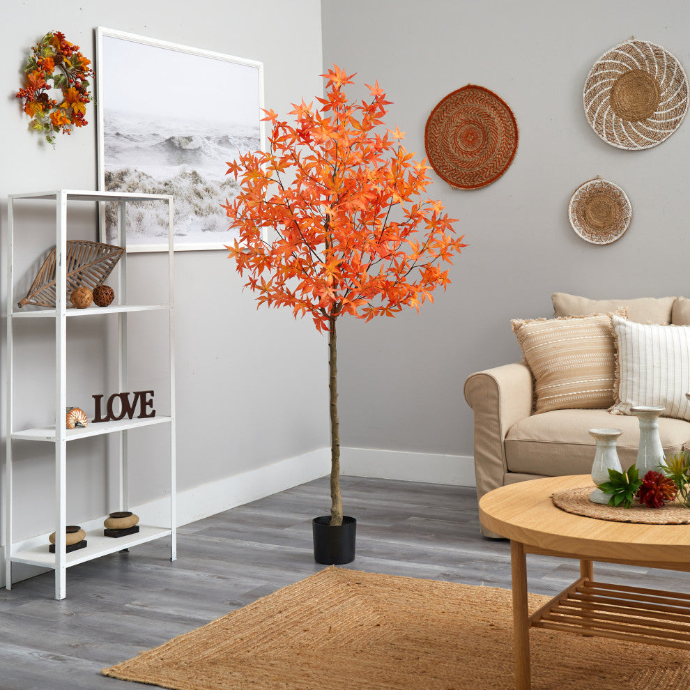 Lifestyle image showing the tree in a room with decor; full product visible and non-white background.