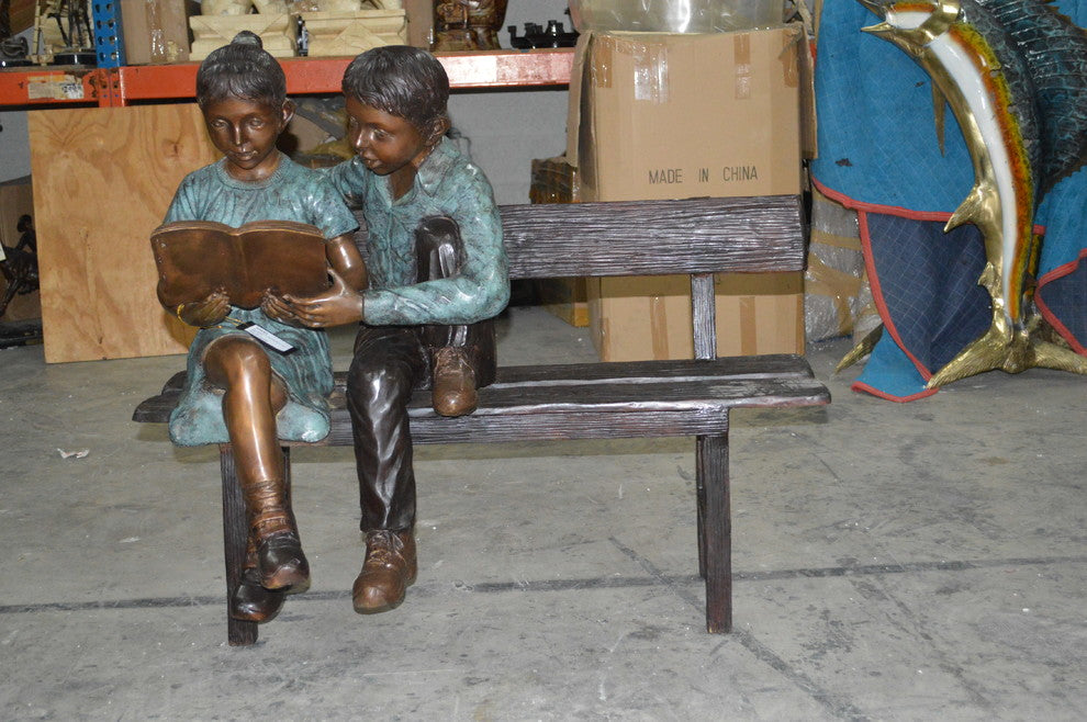 Boy and a Girl on Bench reading book bronze Statue -  Size: 43"L x 20"W x 36"H