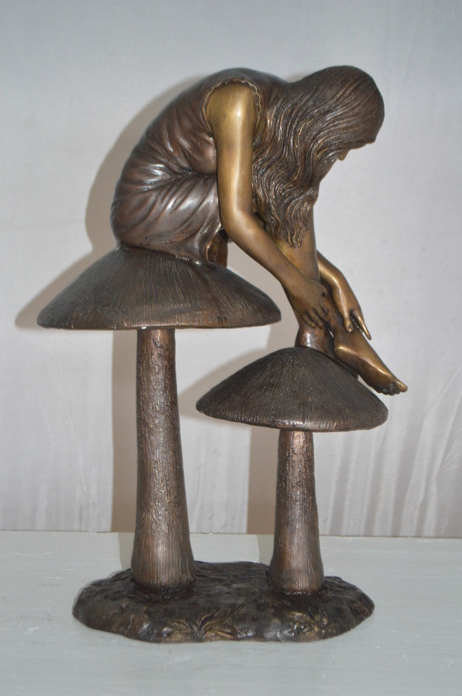 Girl sitting on Mushrooms Bronze Statue -  Size: 13"L x 11"W x 18"H.