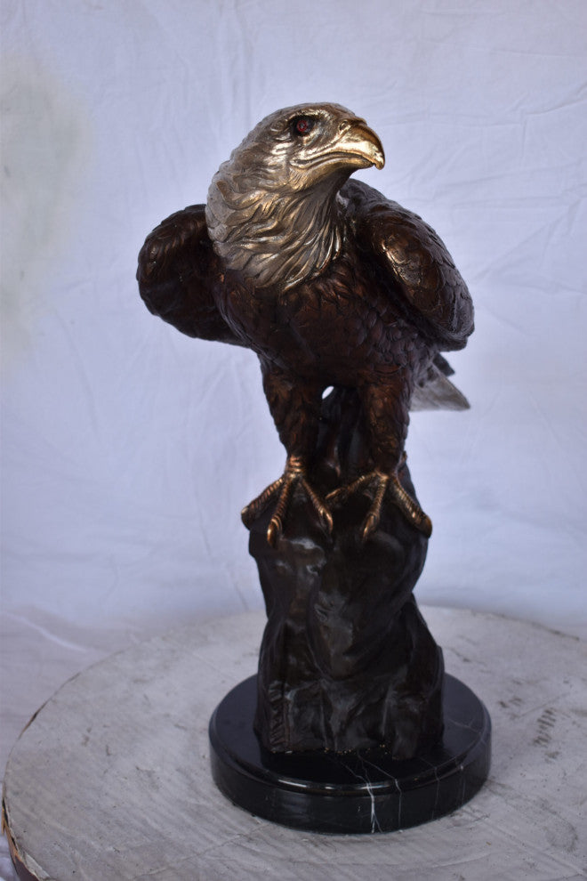 Eagle on Rock Bronze Statue Mounted on Marble Base Size: 10"L x 22"W x 21"H.