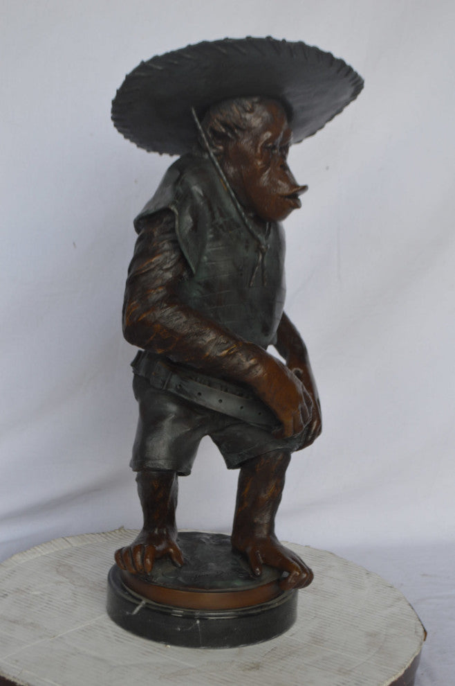 Monkey Cowboy bronze statue - Size: 14"L x 12"W x 29"H.
