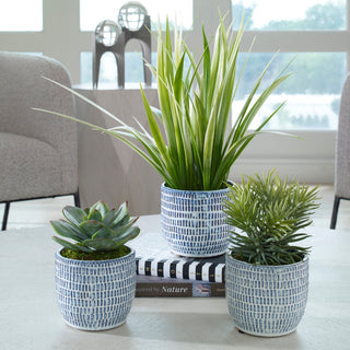 Lifestyle image showing the pots in a real home environment on a table with surrounding decor.