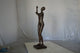 Abstract of nude lady lifting hand bronze statue - Size: 9"L x 6"W x 25"H.