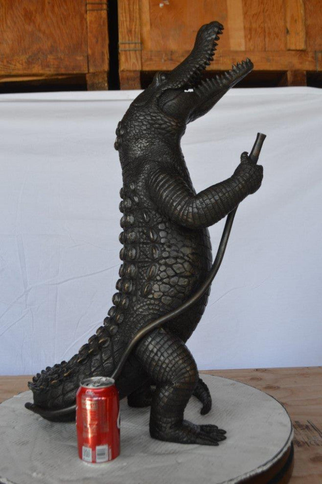 Alligator having fun bronze statue - fountain -  Size: 15"L x 15"W x 31"H.