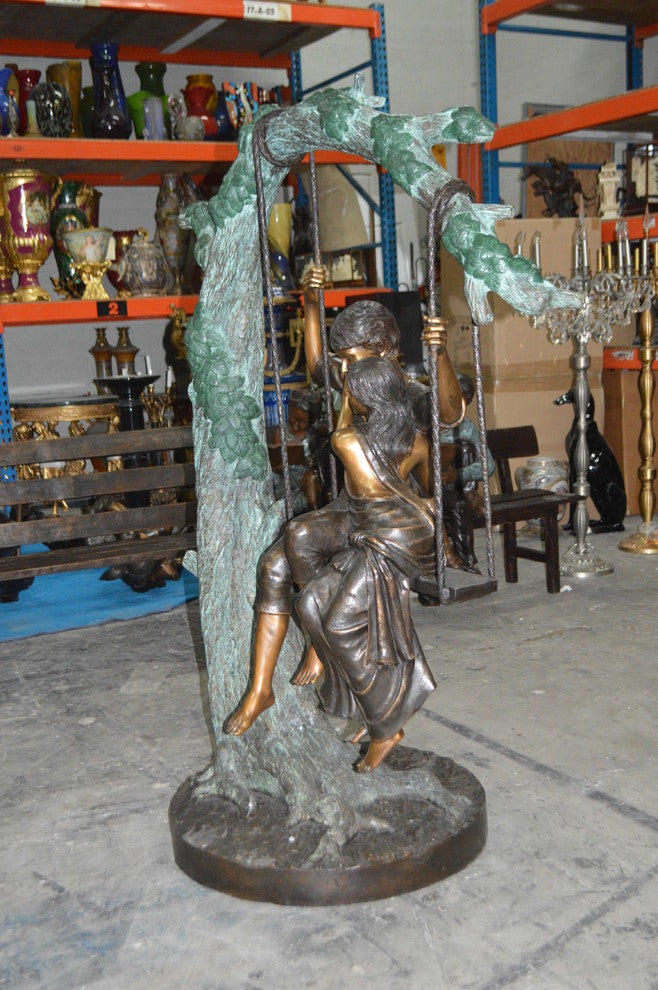 Lovers on a Swing Bronze Statue -  Size: 48"L x 32"W x 64"H.