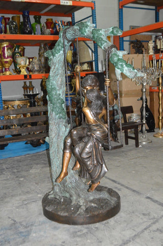 Lovers on a Swing Bronze Statue -  Size: 48"L x 32"W x 64"H.