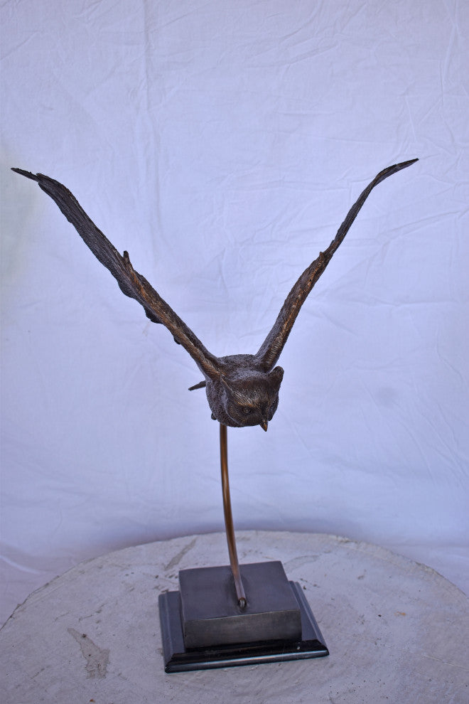 Owl Searching for Prey Bronze Statue Size: 18"L x 11"W x 22"H.